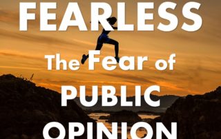 Fearless: the fear of Public Opinion, over a picture of a woman jumping a canyon