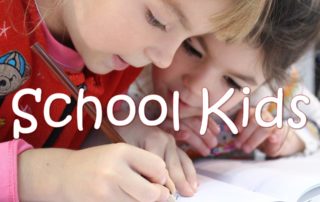 two young children doing school work